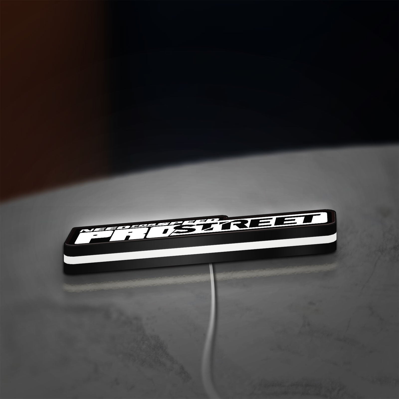 Need for Speed Prostreet Sign LED lightbox lying flat on a desk with white glow