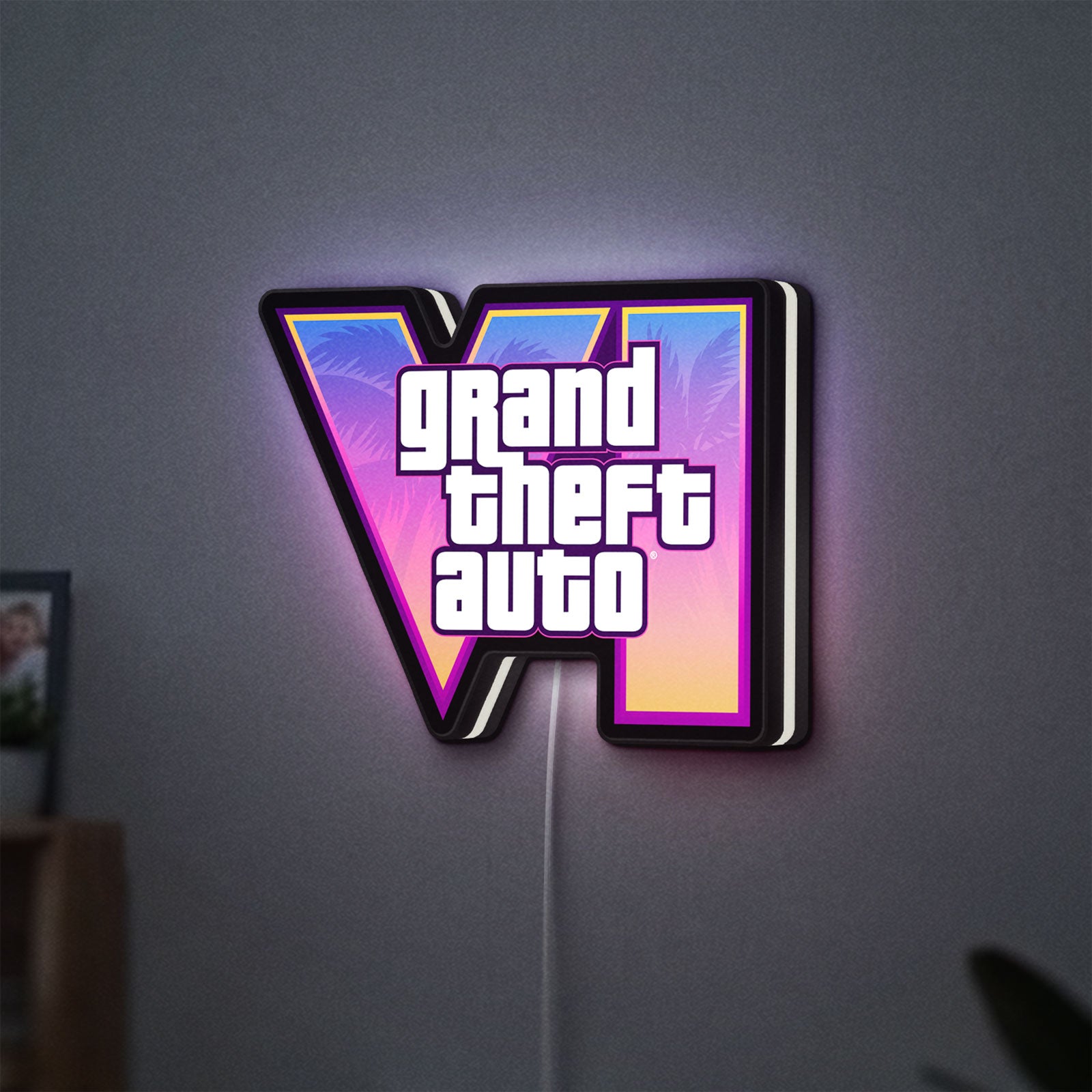 GTA VI LED lightbox hanging on a wall with white glow