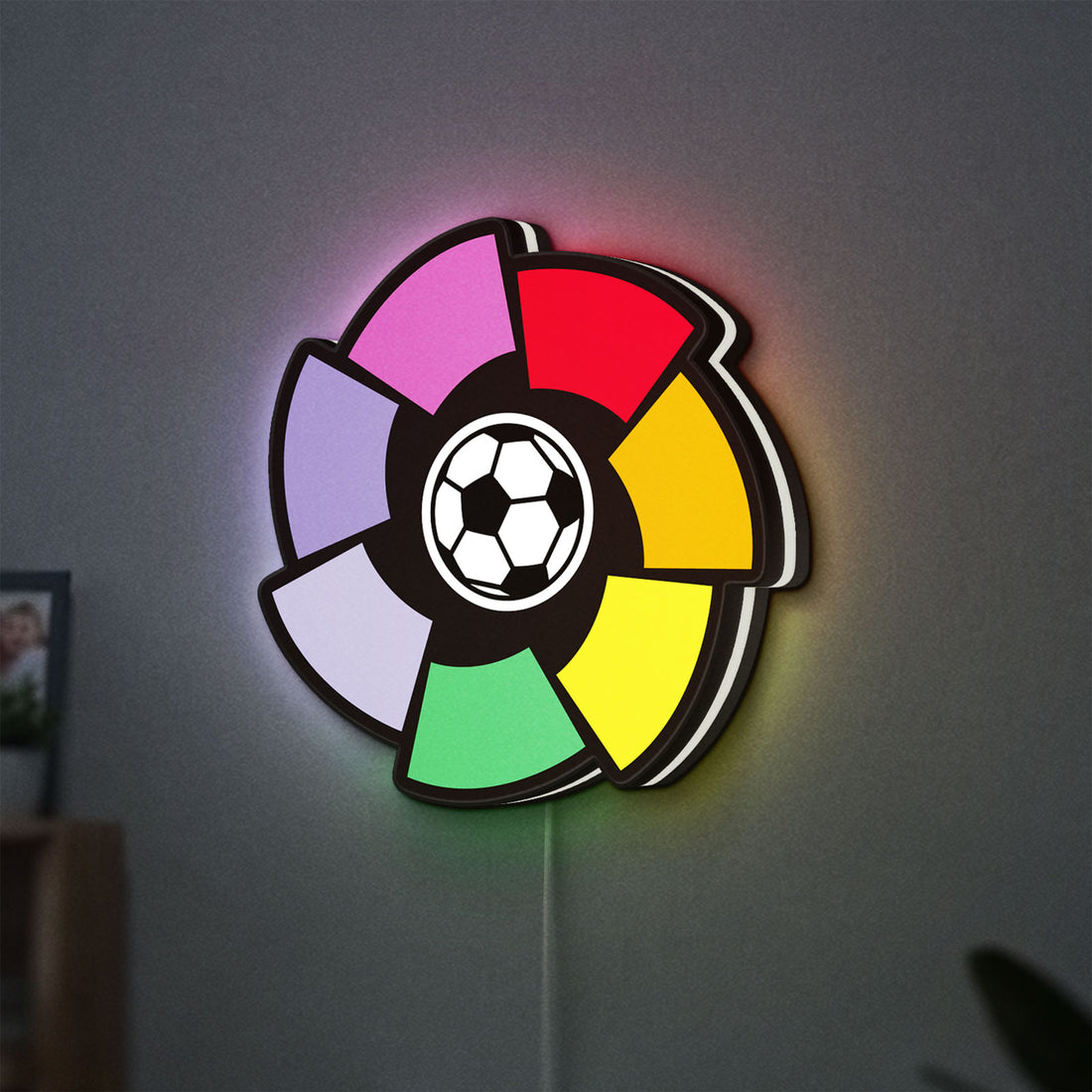 La Liga LED lightbox hanging on a wall with white glow