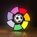 Front view of La Liga LED lightbox sign glowing on a wooden desk