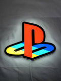 Illuminated flat lay front view of Playstation 3D LED Sign in 20cm, unique wall art for desk and room decor