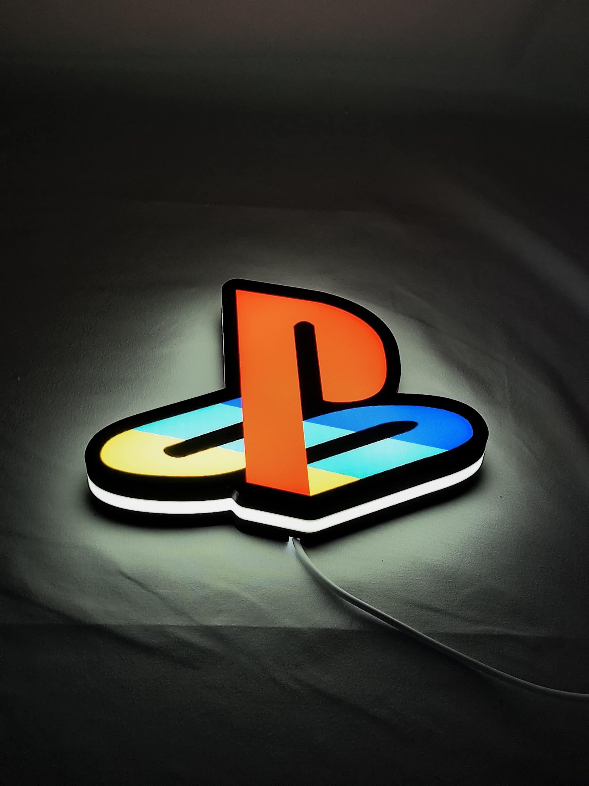 Playstation LED Light Box (20cm) - Illuminated flat lay angled view, unique wall art for desk and room decor