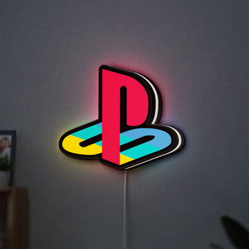 Playstation LED lightbox hanging on a wall with white glow