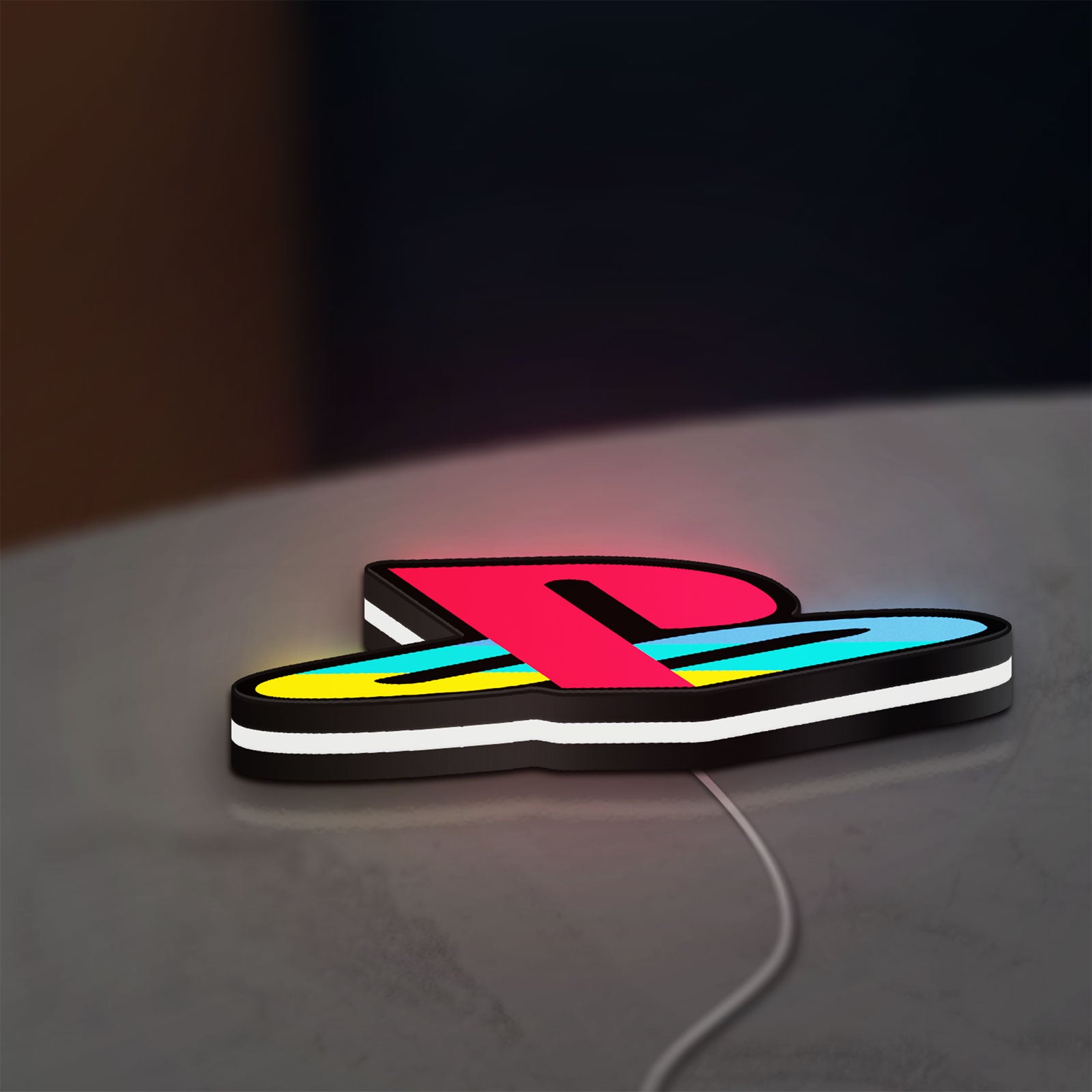 Playstation LED lightbox lying flat on a desk with white glow
