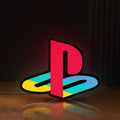Front view of Playstation LED lightbox sign glowing on a wooden desk