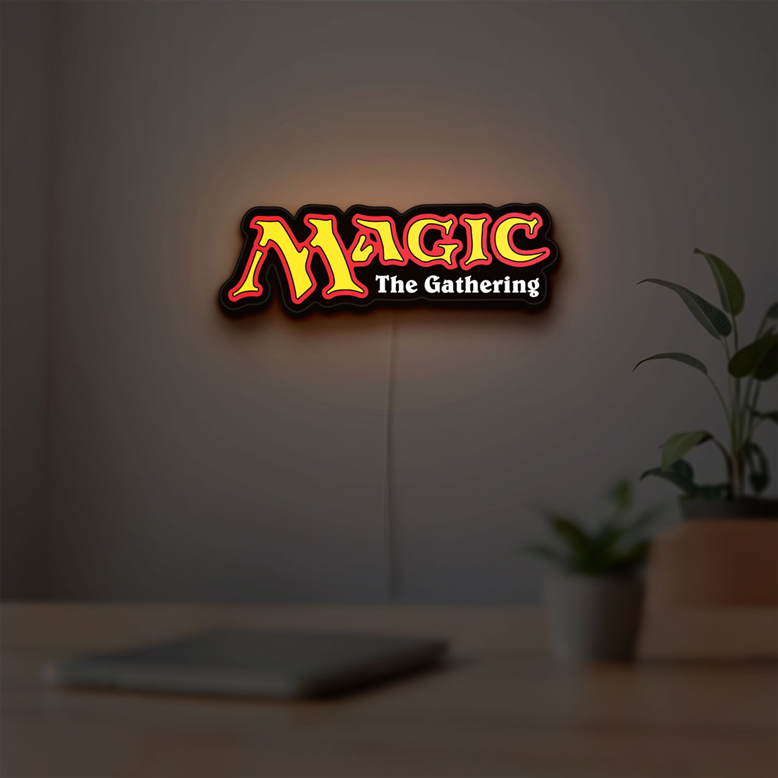 Magic The Gathering LED lightbox hanging on a room wall with soft yellow light