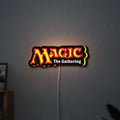 Magic The Gathering LED lightbox hanging on a wall with yellow glow