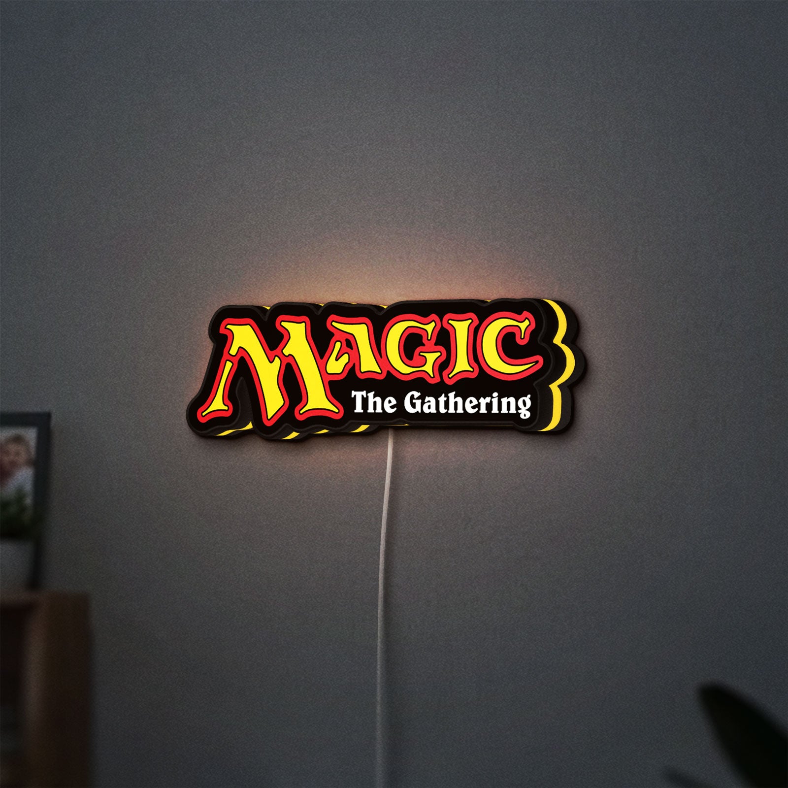 Magic The Gathering LED lightbox hanging on a wall with yellow glow
