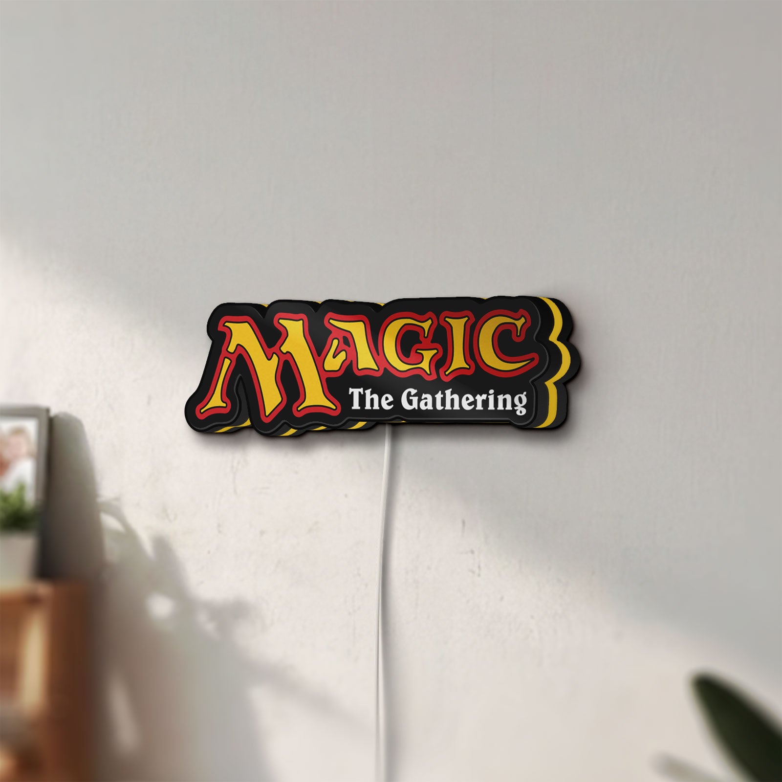 Unlit Magic The Gathering LED lightbox mounted on a wall in daylight
