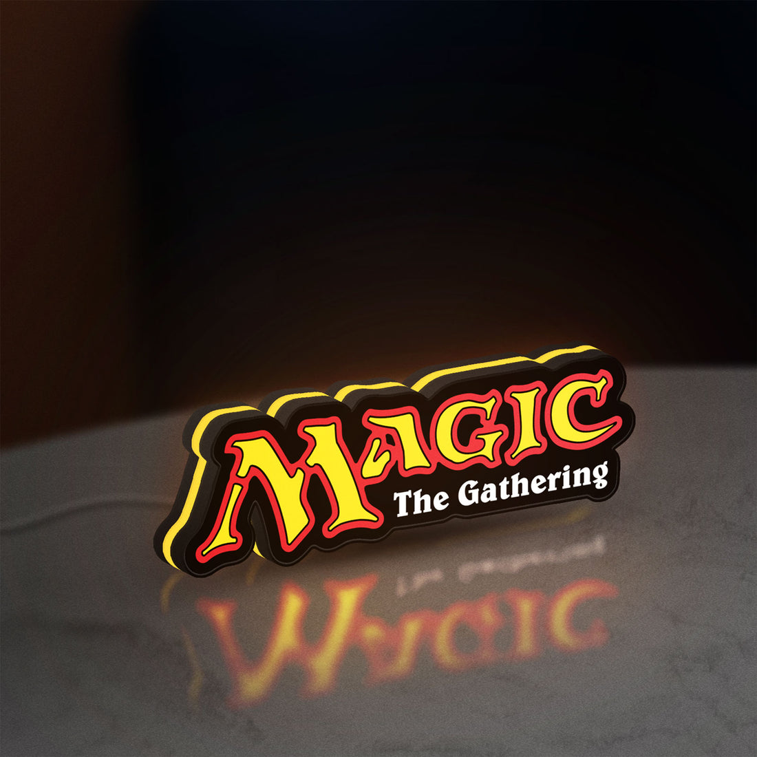 Magic The Gathering LED lightbox hanging on a wall with yellow glow