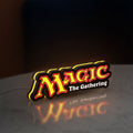 Magic The Gathering LED lightbox standing on a desk from an angled side view with yellow glow