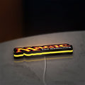 Magic The Gathering LED lightbox lying flat on a desk with yellow glow