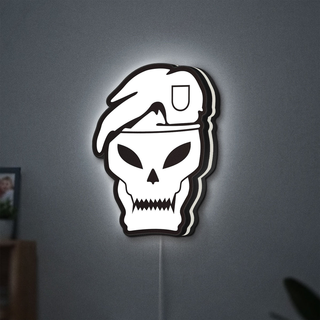 Call of Duty Black Ops LED lightbox hanging on a wall with white glow