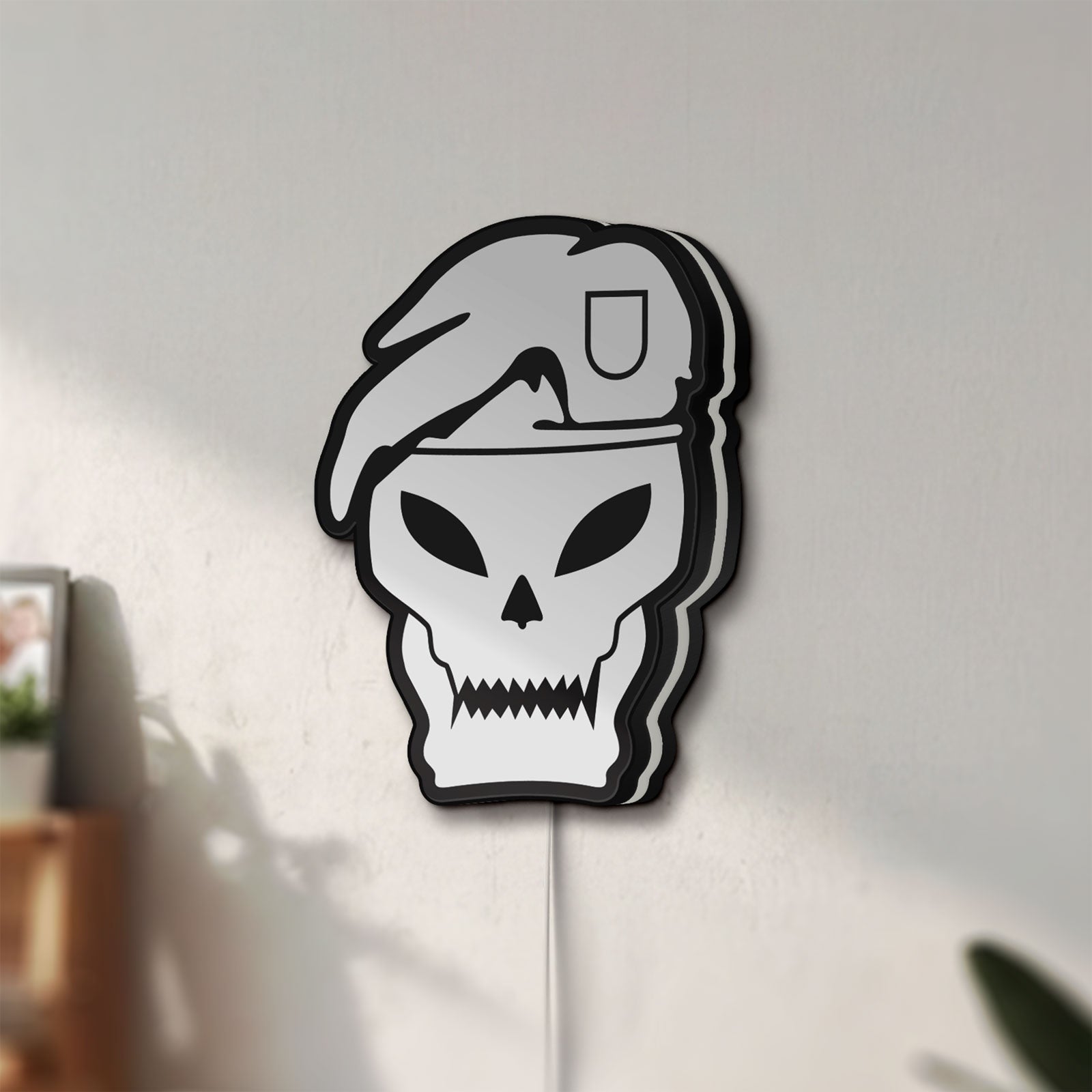Unlit Call of Duty Black Ops LED lightbox mounted on a wall in daylight