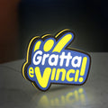 Gratta e Vinci LED lightbox standing on a desk from an angled side view with yellow glow