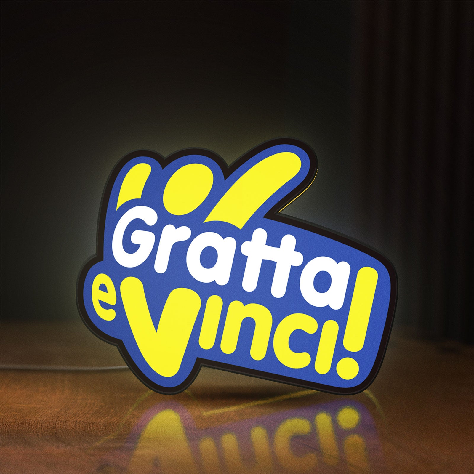 Front view of Gratta e Vinci LED lightbox sign glowing on a wooden desk