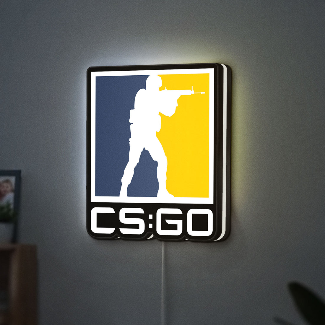 CSGO LED lightbox hanging on a wall with white glow