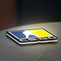 CSGO LED lightbox lying flat on a desk with white glow