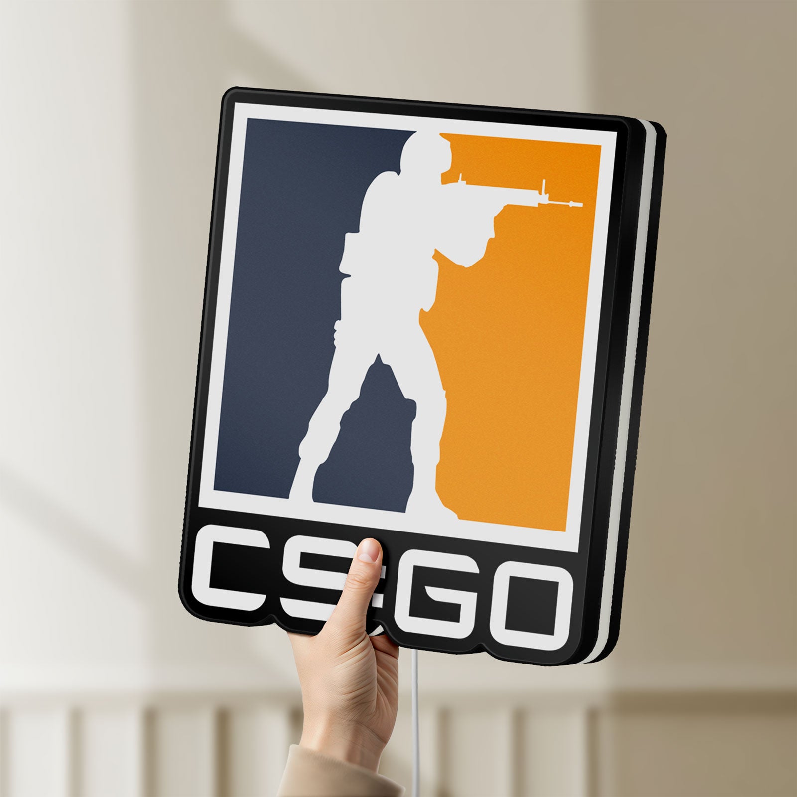Unlit CSGO LED lightbox held by hand to show size and details