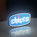 Chicco LED lightbox standing on a desk from an angled side view with blue glow