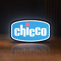 Front view of Chicco LED lightbox sign glowing on a wooden desk