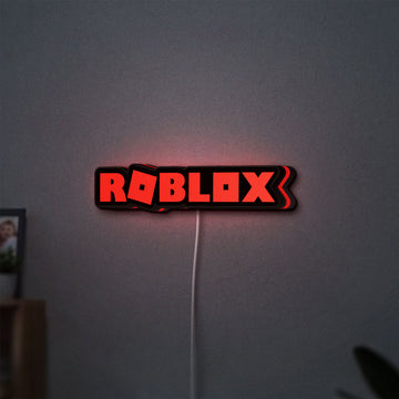 Roblox LED lightbox hanging on a wall with red glow