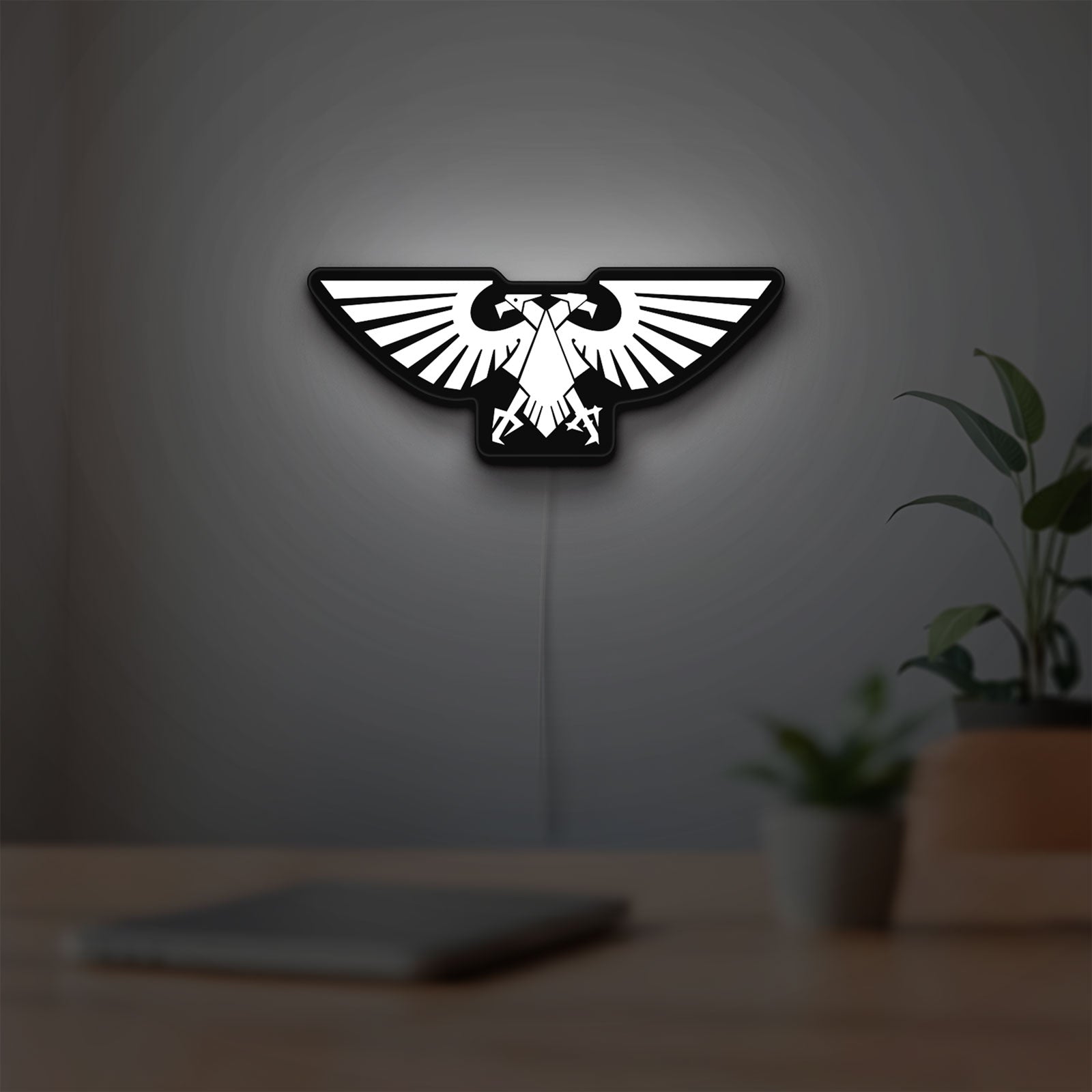 Imperial Aquila LED lightbox hanging on a room wall with soft white light