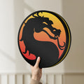 Unlit Mortal Kombat LED lightbox held by hand to show size and details