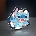 Stitch LED lightbox standing on a desk from an angled side view with white glow