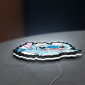 Stitch LED lightbox lying flat on a desk with white glow
