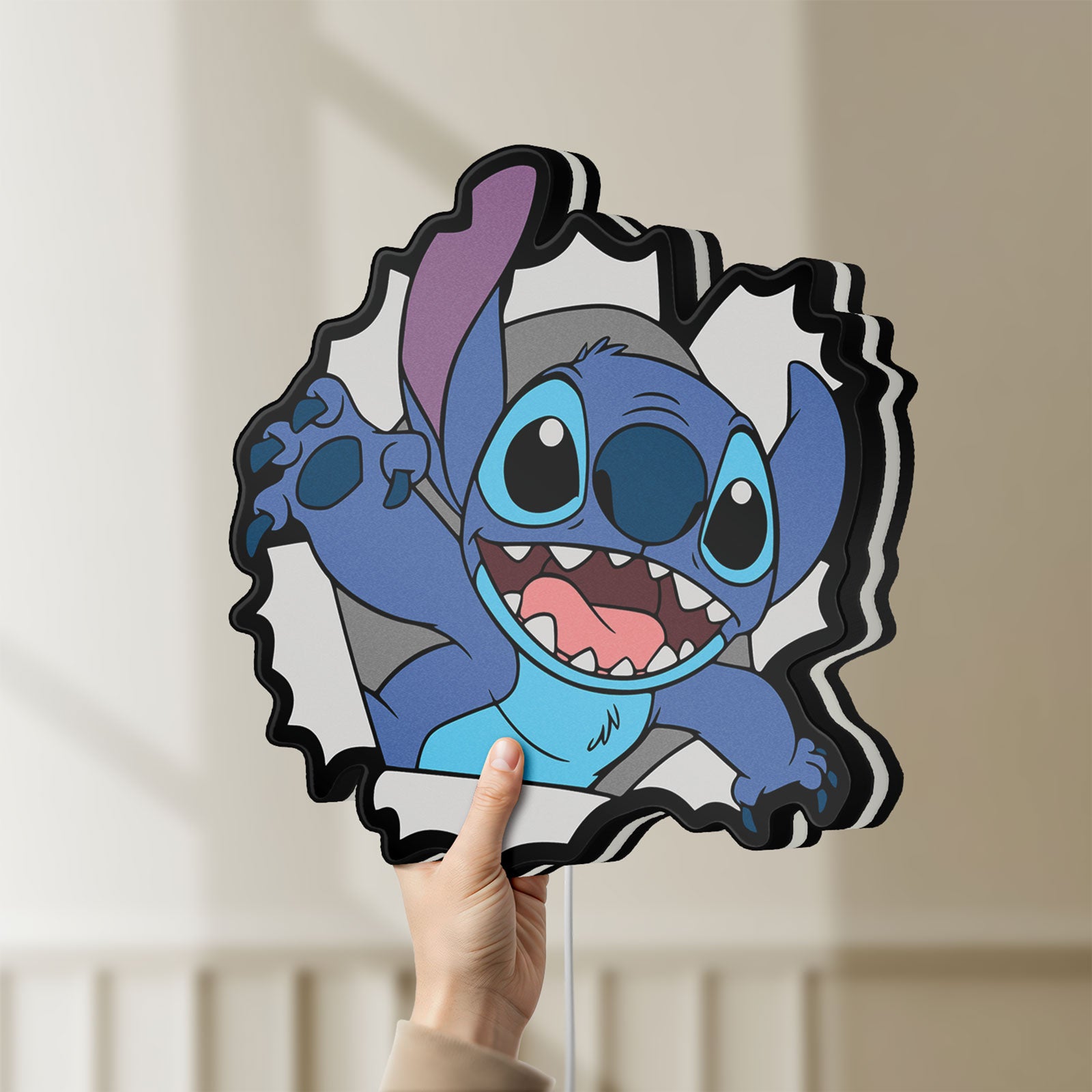 Unlit Stitch LED lightbox held by hand to show size and details