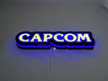 Capcom LED Light Box (30cm) - Illuminated flat lay angled view, unique wall art for desk and room decor