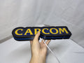 30cm Capcom Glowing Wall Art - Unlit handheld size reference, unique wall art for desk and room decor