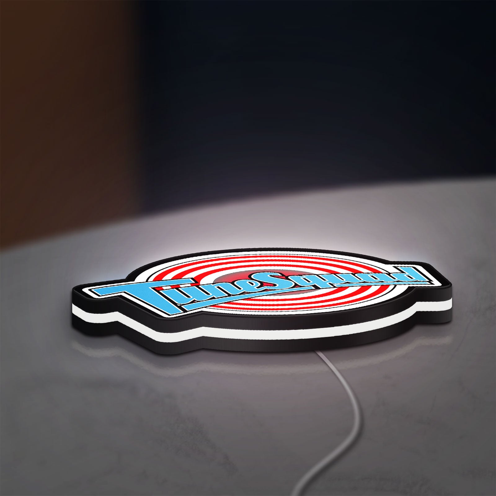 TuneSquad LED lightbox lying flat on a desk with white glow