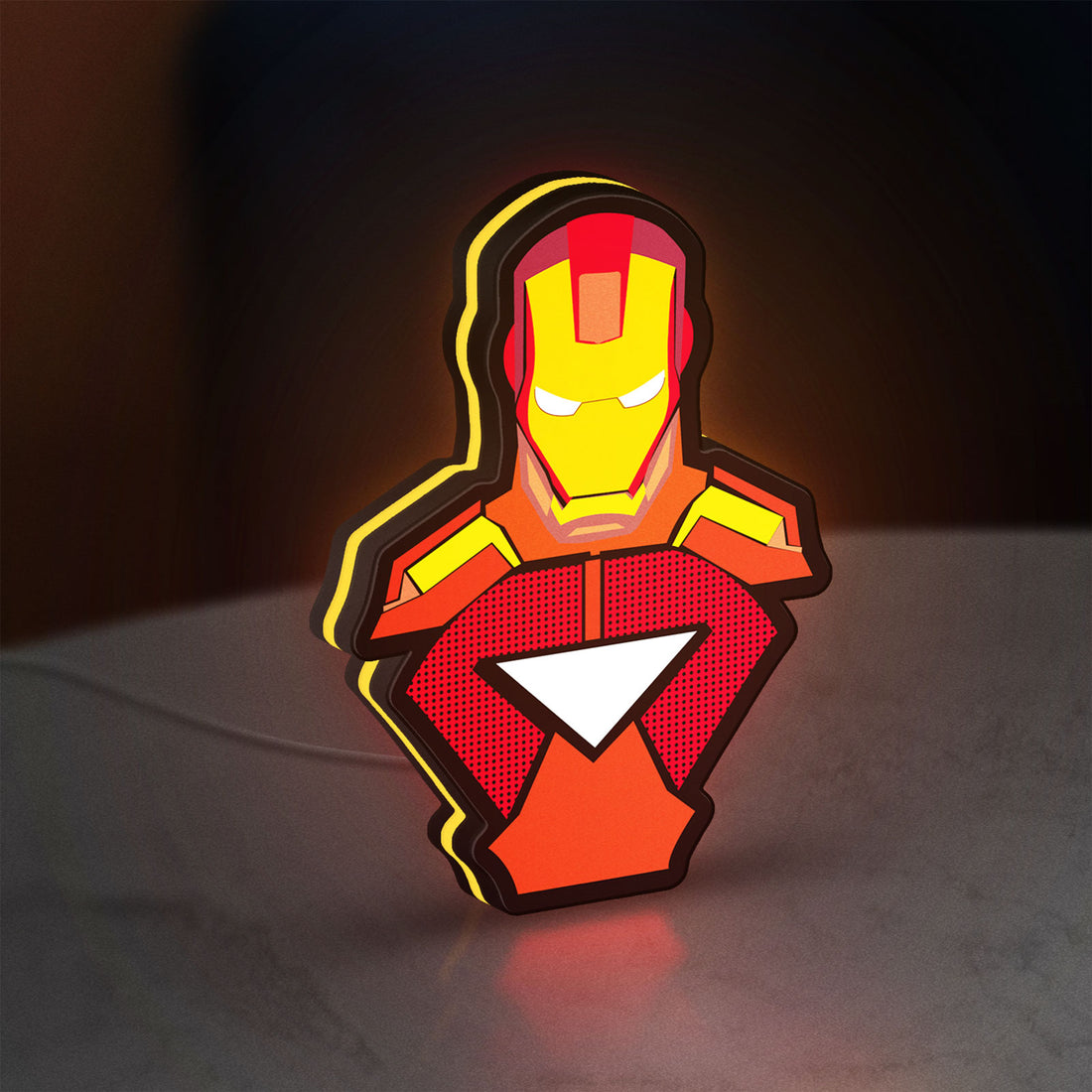 Iron Man LED lightbox hanging on a wall with yellow glow