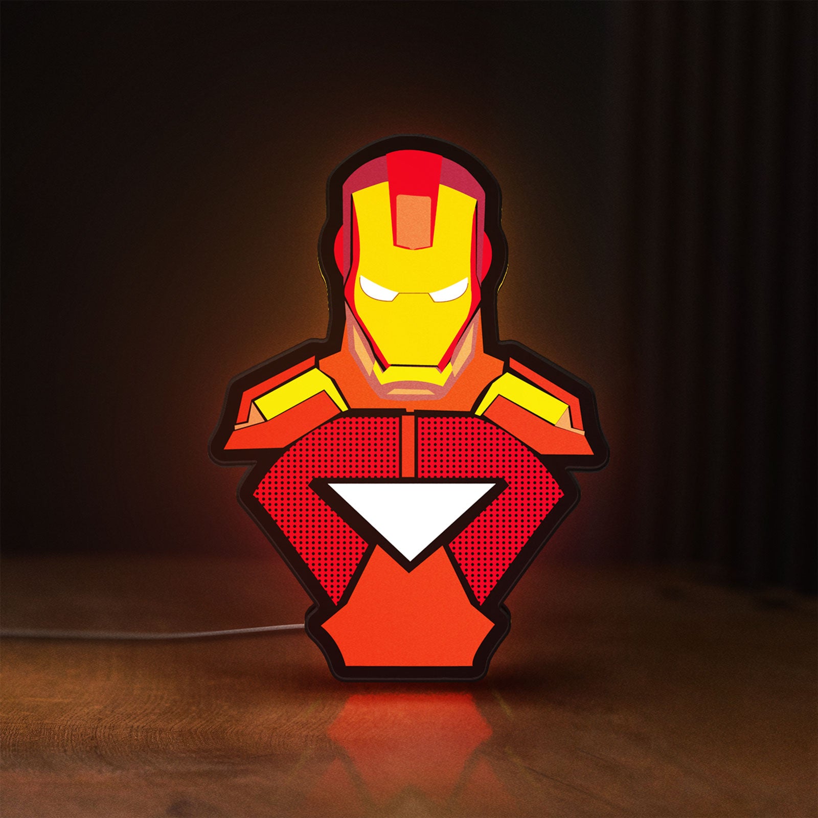 Front view of Iron Man LED lightbox sign glowing on a wooden desk