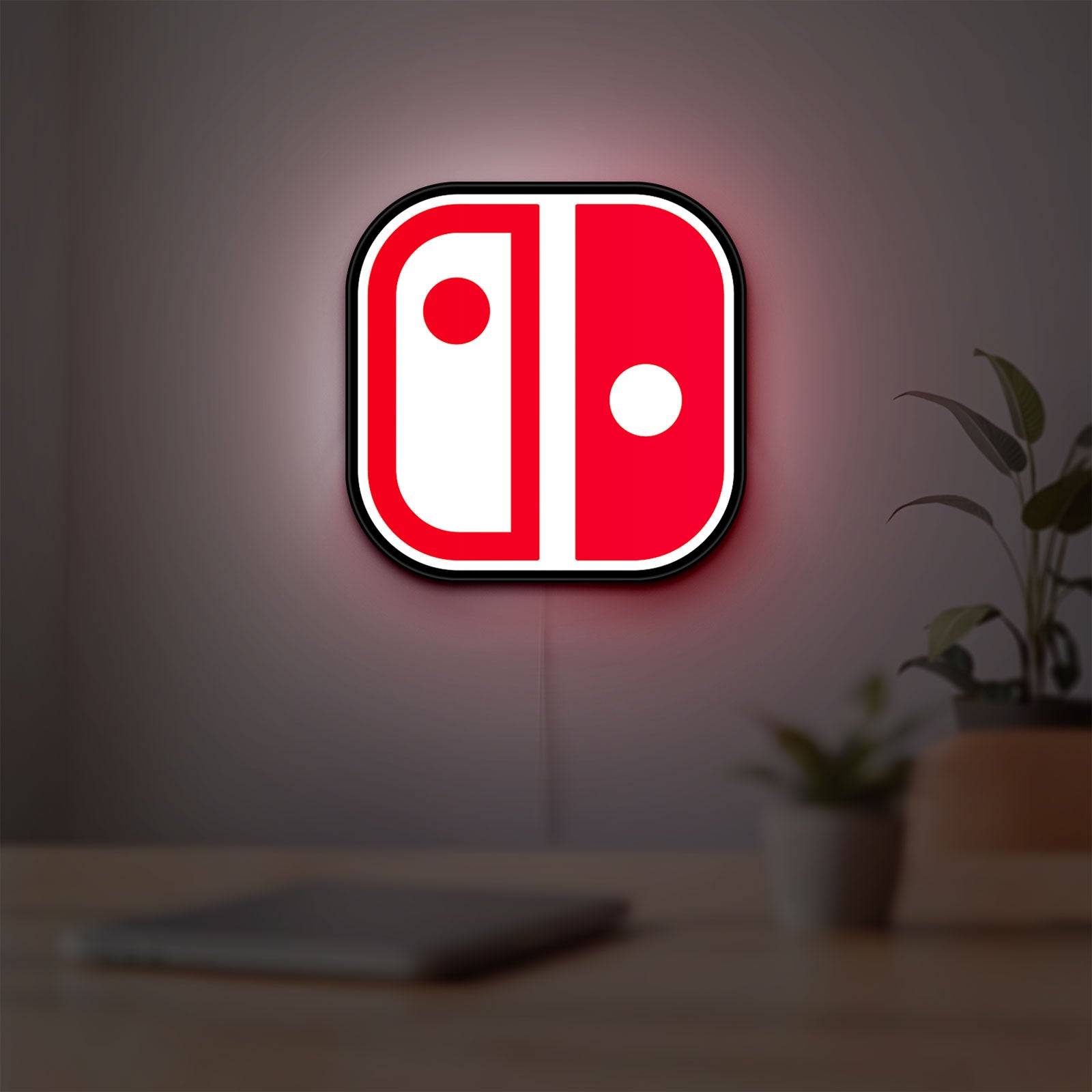 Nintendo Switch LED lightbox hanging on a room wall with soft red light