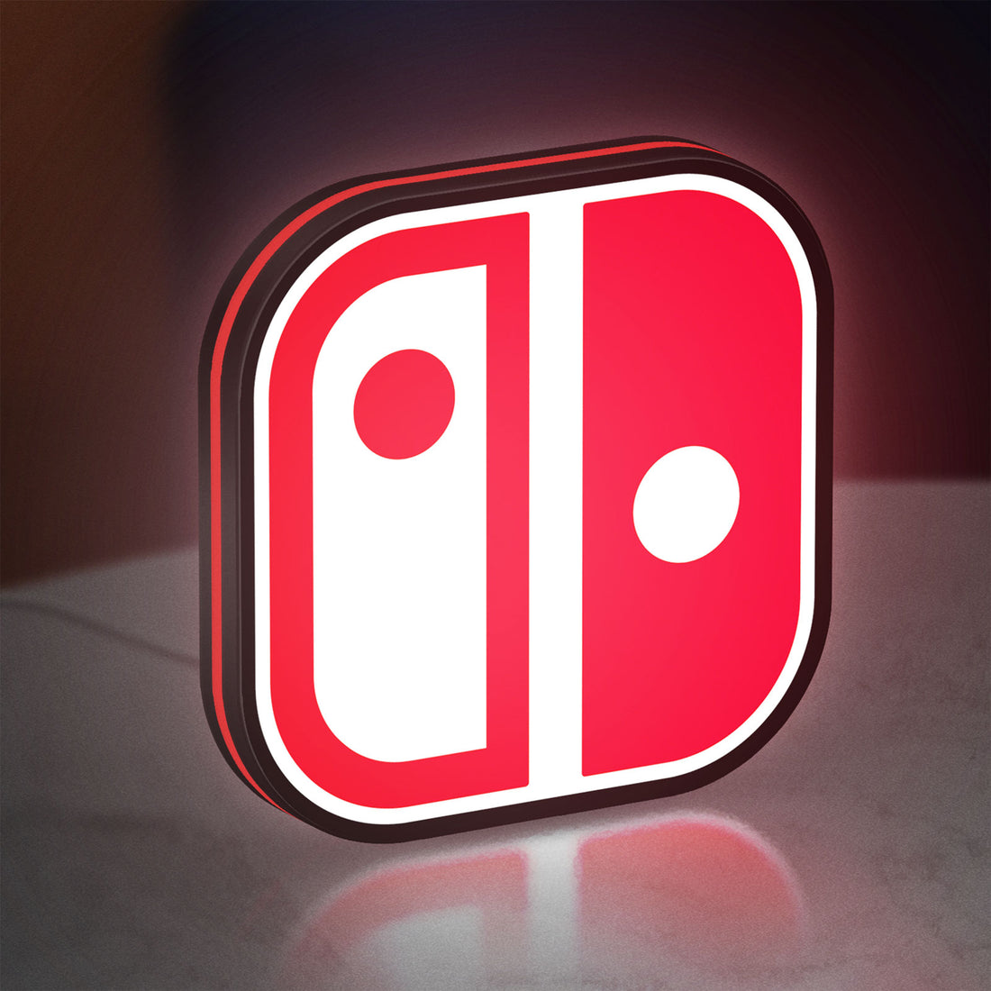 Nintendo Switch LED lightbox hanging on a wall with red glow
