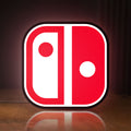 Front view of Nintendo Switch LED lightbox sign glowing on a wooden desk