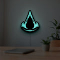 Assassins Creed Valhalla LED lightbox hanging on a room wall with soft green light