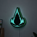 Assassins Creed Valhalla LED lightbox hanging on a wall with green glow