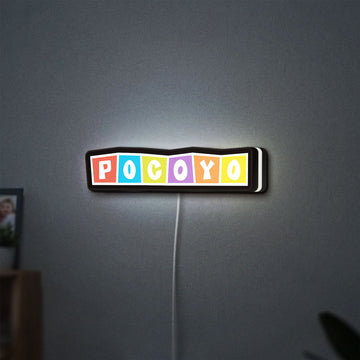 Pocoyo LED lightbox hanging on a wall with white glow