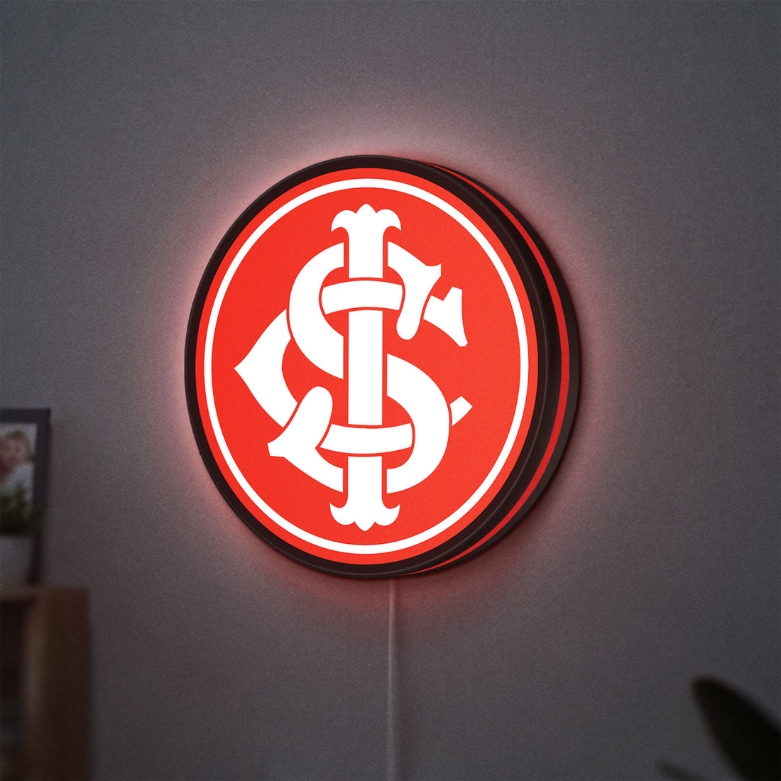 Sport Club Internacional 6 Estrelas LED lightbox hanging on a wall with red glow