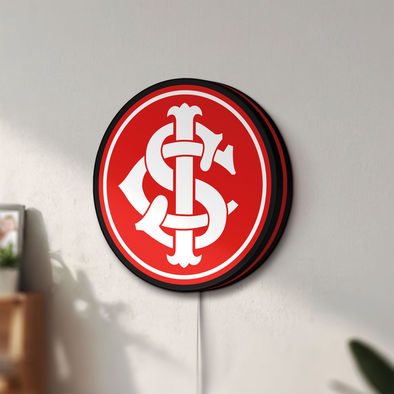 Unlit Sport Club Internacional 6 Estrelas LED lightbox mounted on a wall in daylight