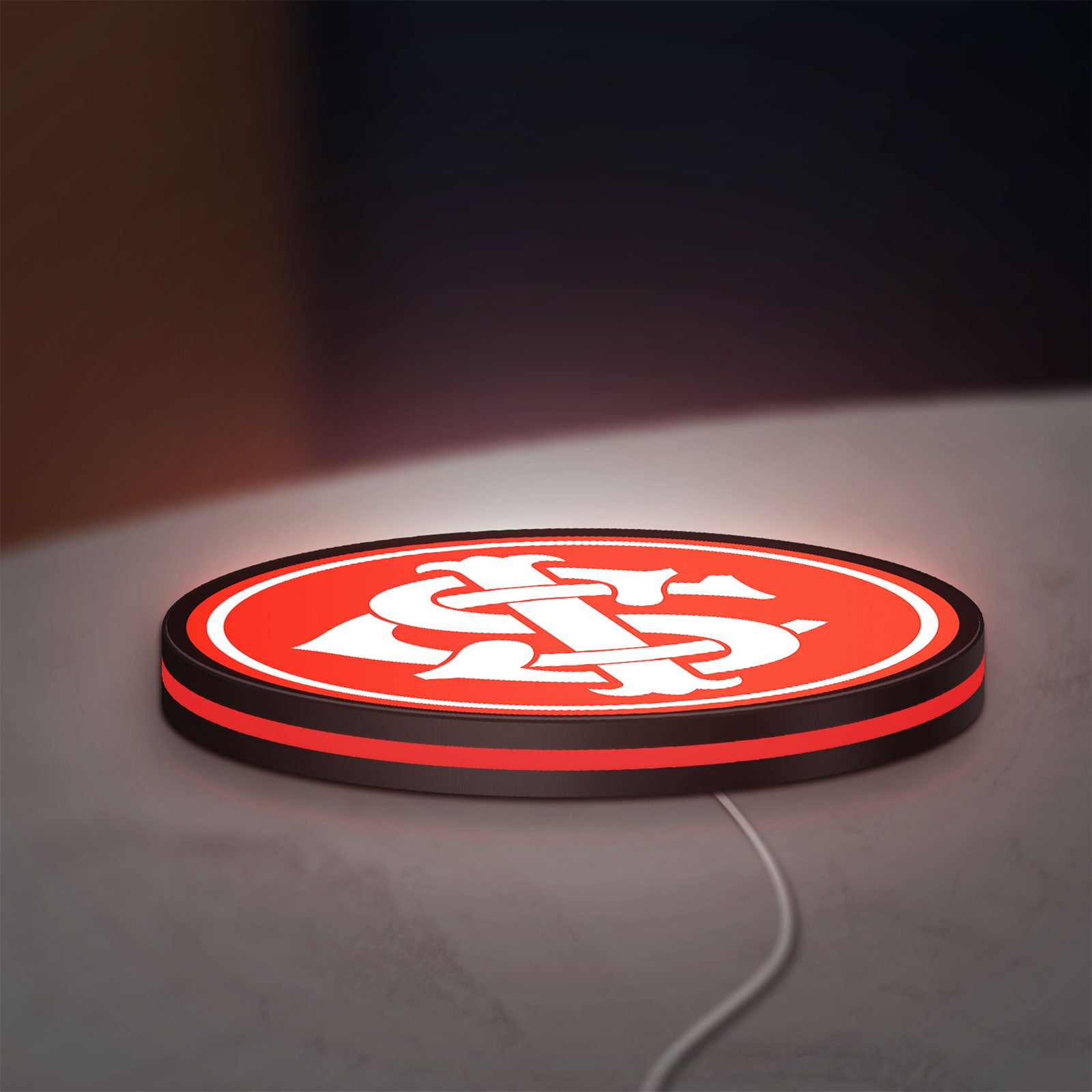 Sport Club Internacional 6 Estrelas LED lightbox lying flat on a desk with red glow