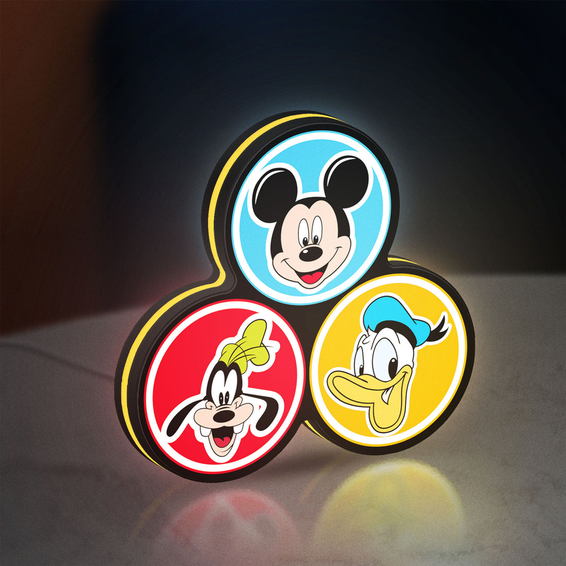 MICKEY DONALD GOOFIE LED lightbox hanging on a wall with yellow glow