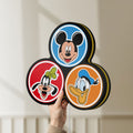 Unlit MICKEY DONALD GOOFIE LED lightbox held by hand to show size and details