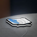 Wings of Freedom 2021 LED lightbox lying flat on a desk with white glow