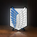 Front view of Wings of Freedom 2021 LED lightbox sign glowing on a wooden desk