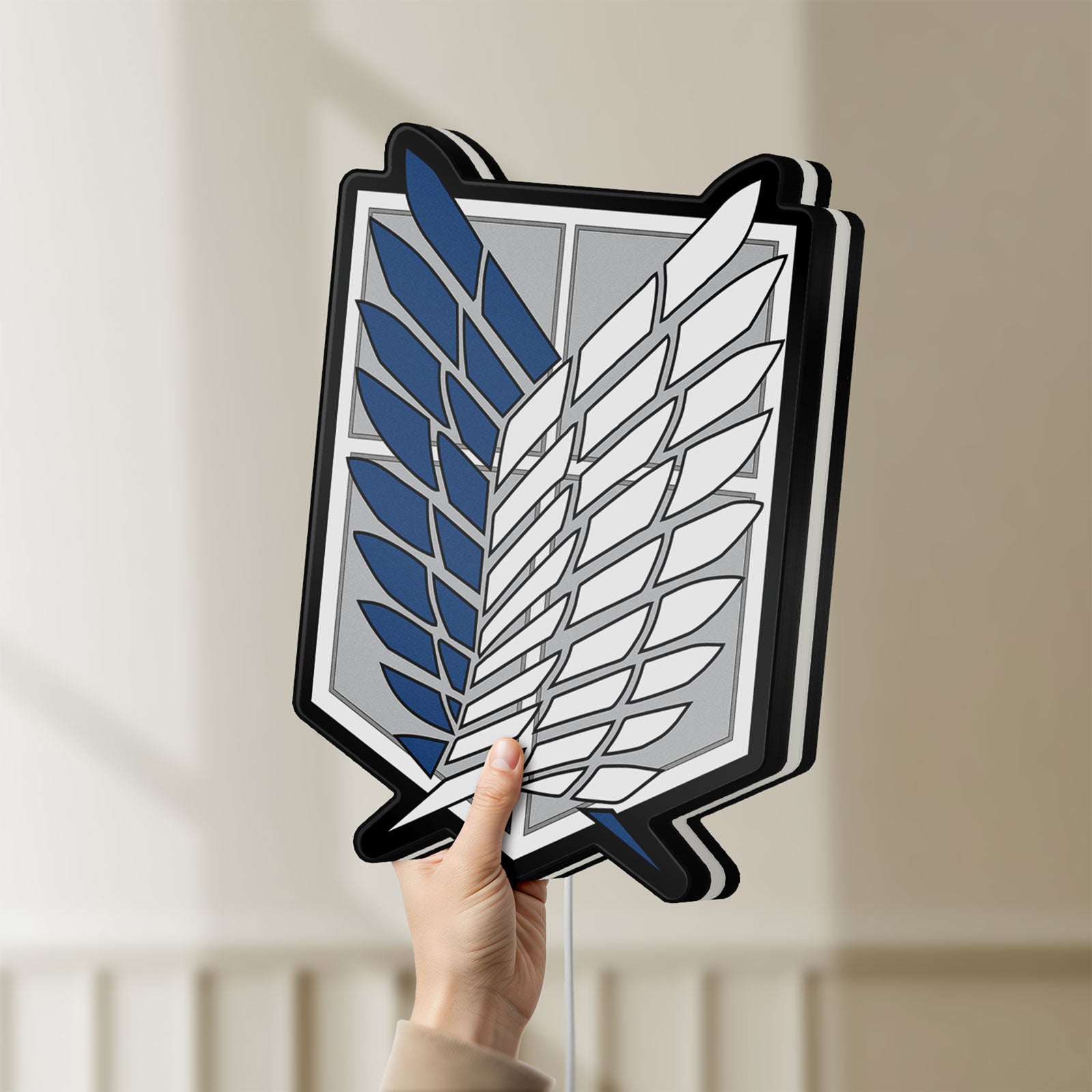 Unlit Wings of Freedom 2021 LED lightbox held by hand to show size and details